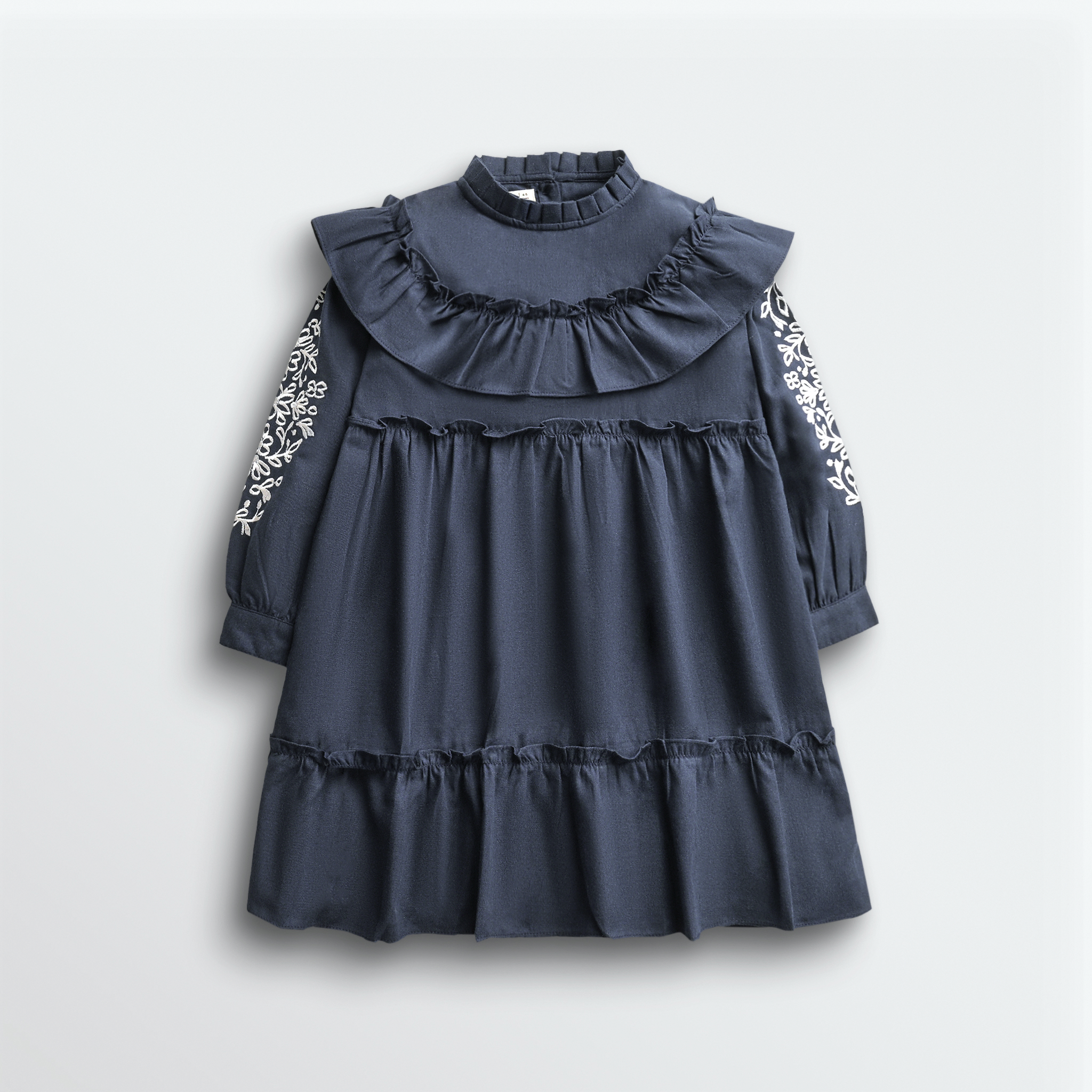 Navy blue dress with ruffled collar and sleeves, and floral embroidery.