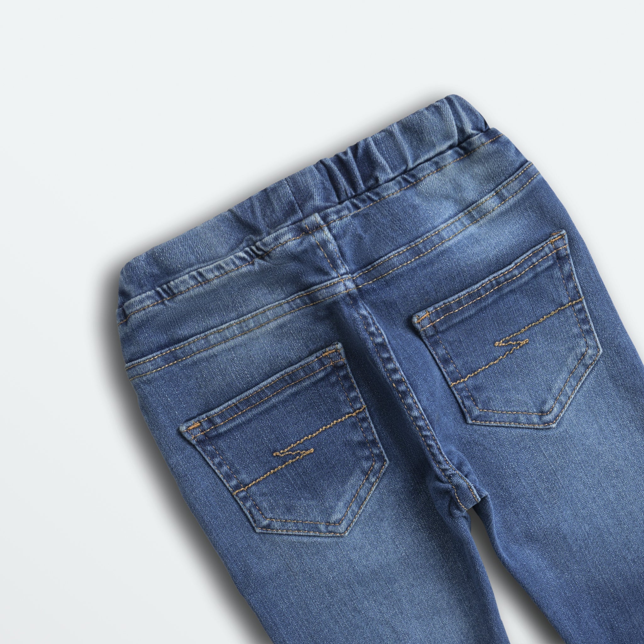 Blue jeans with a plain background