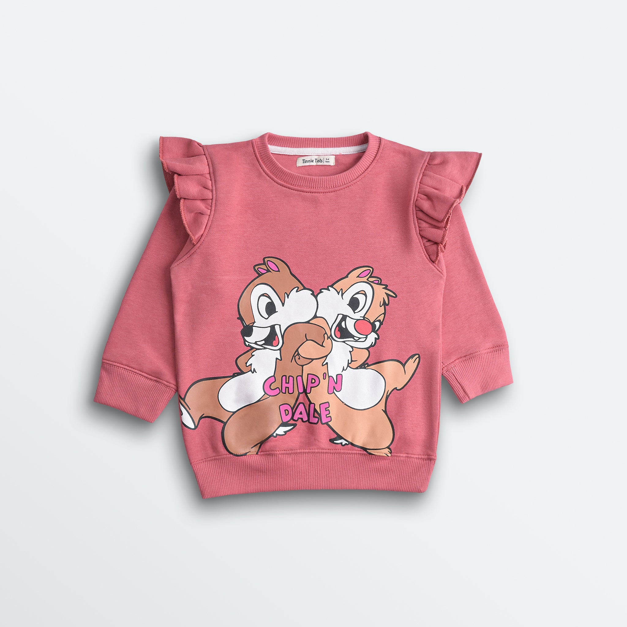 Pink children's sweatshirt with cartoon characters on a light gray background