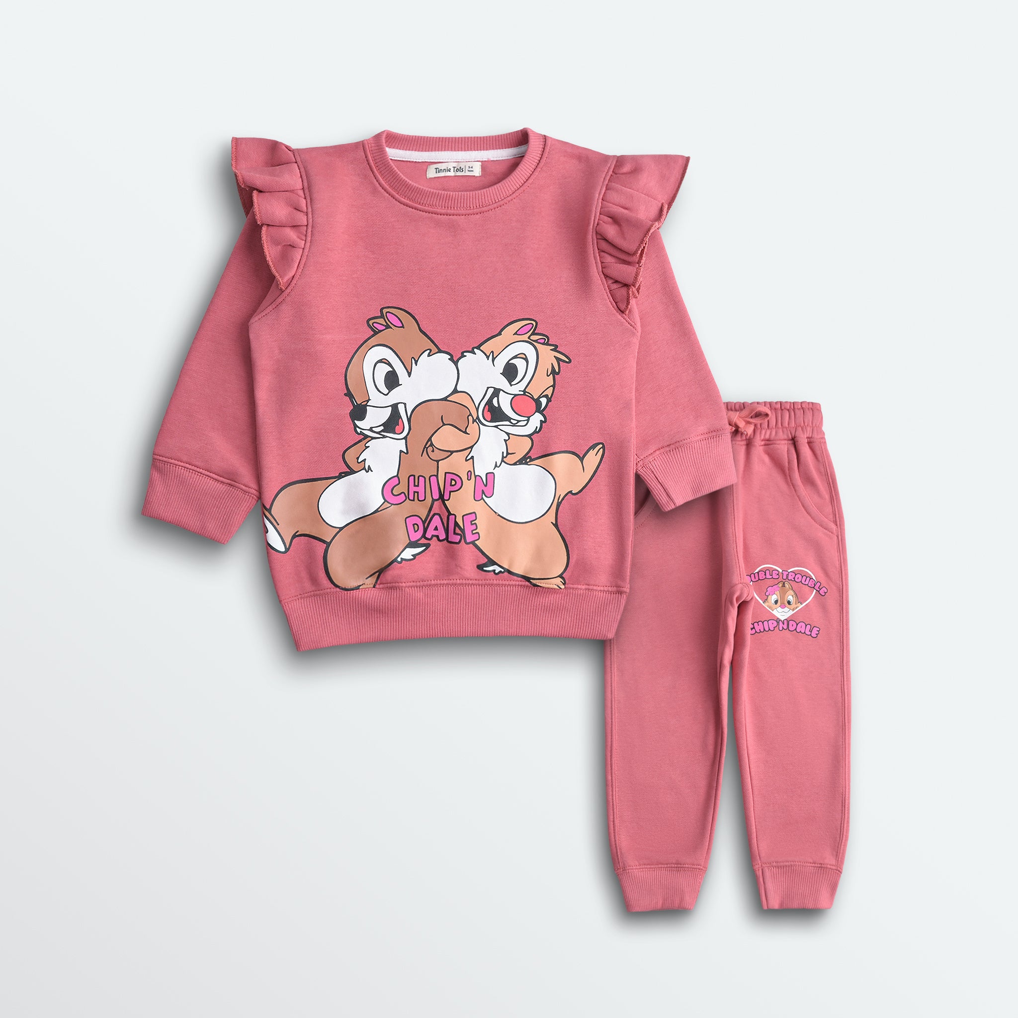 Pink children's sweatshirt and pants set with cartoon characters on a white background